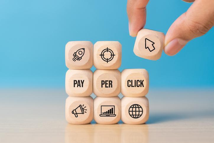 Pay-per-click advertising blocks illustrating paid media budget allocation for schools